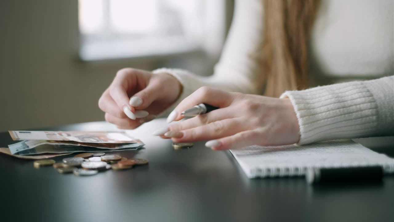 Loan documents and a calculator on a desk