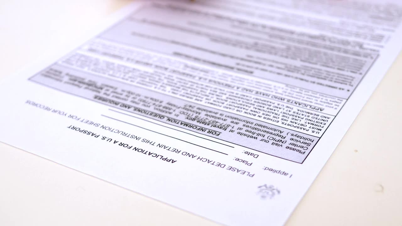 Two people signing closing documents