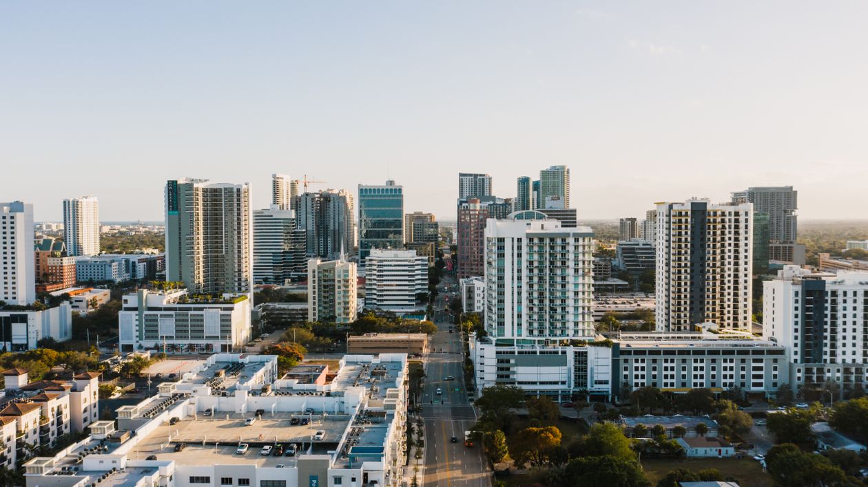 Fort Lauderdale downtown skyline at sunset with glass office towers and urban streets