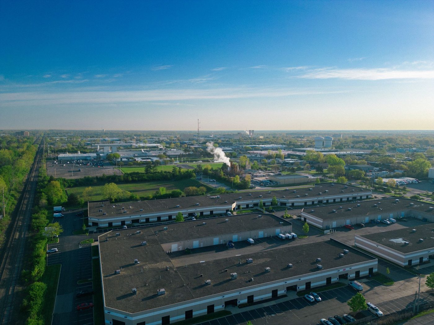 Aerial view of a Central Florida suburban commercial district with warehouses and retail