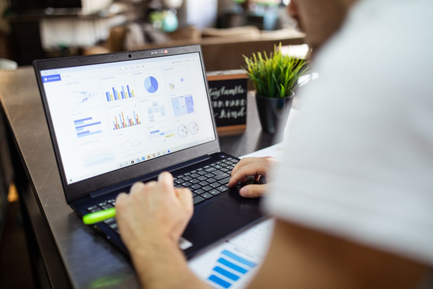 Business analytics dashboard with charts displayed on a laptop screen