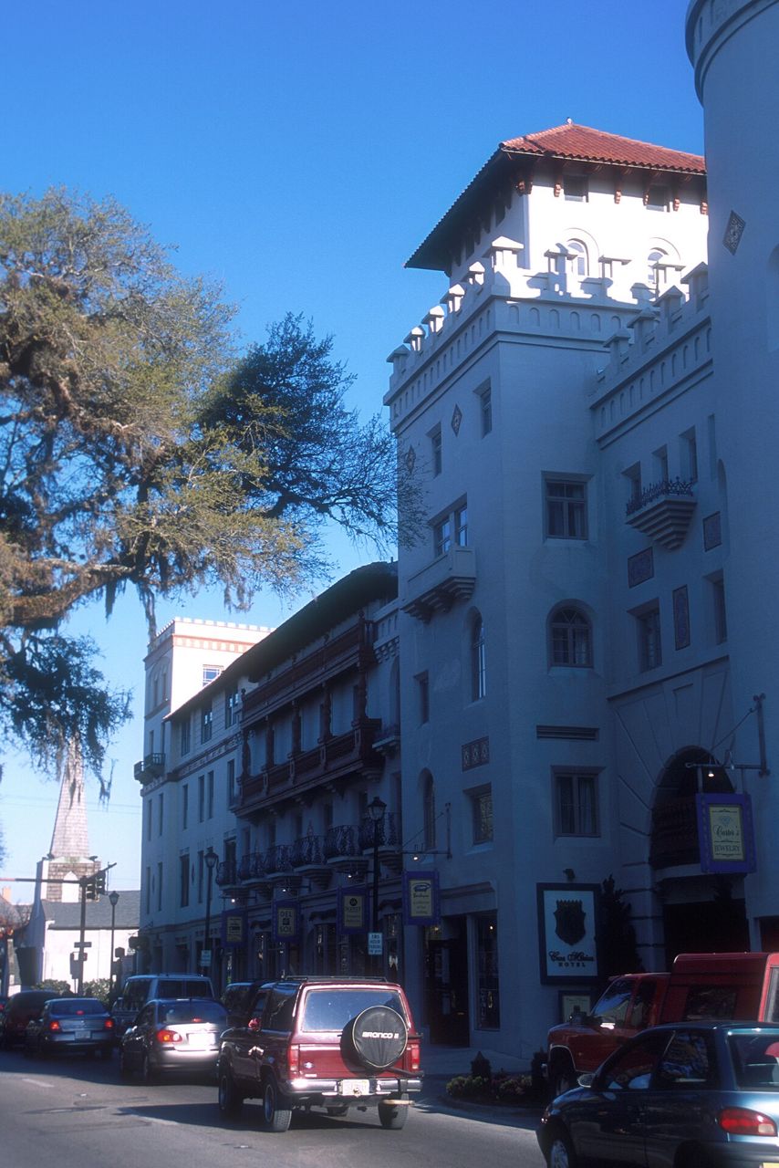 A historic building and parked cars on a street in downtown St. Augustine