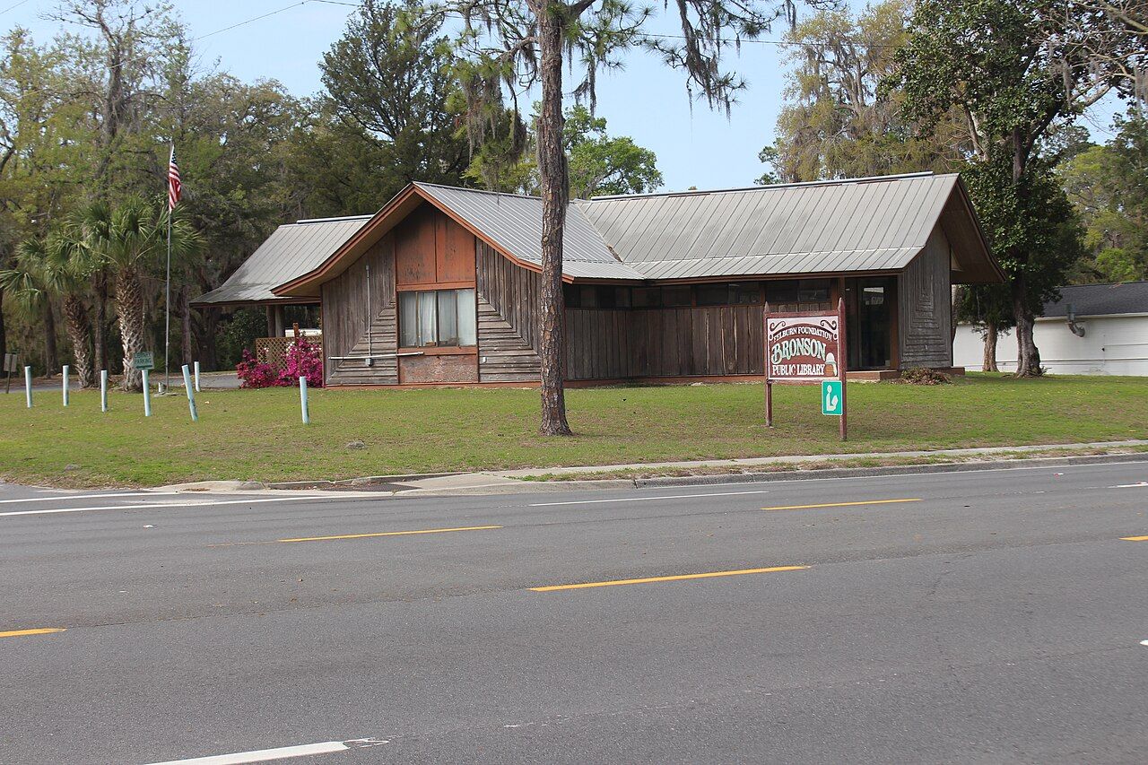 A small wooden public library building in Bronson, Florida