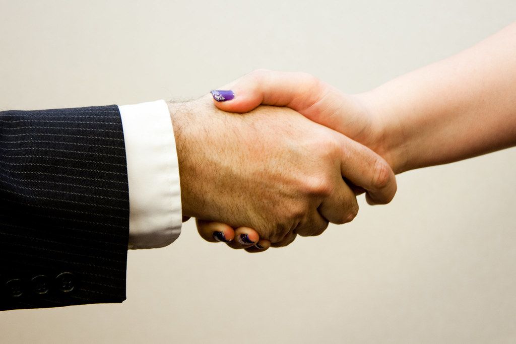 A business partnership handshake
