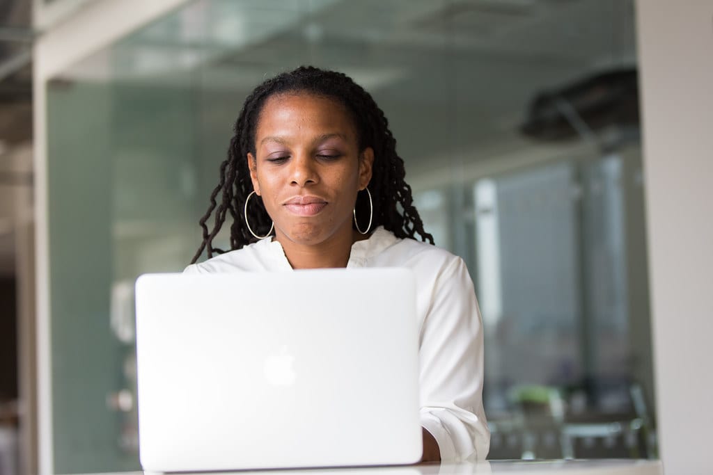 A professional working with Florida business data on a laptop