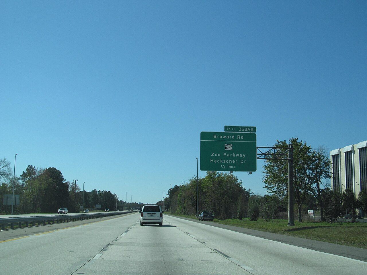 Traffic on an interstate highway in Florida with an overhead exit sign