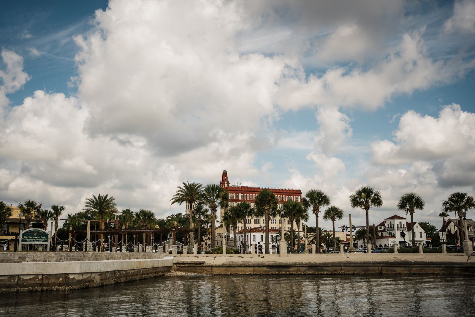 St. Augustine waterfront with palms and the old city skyline under afternoon clouds
