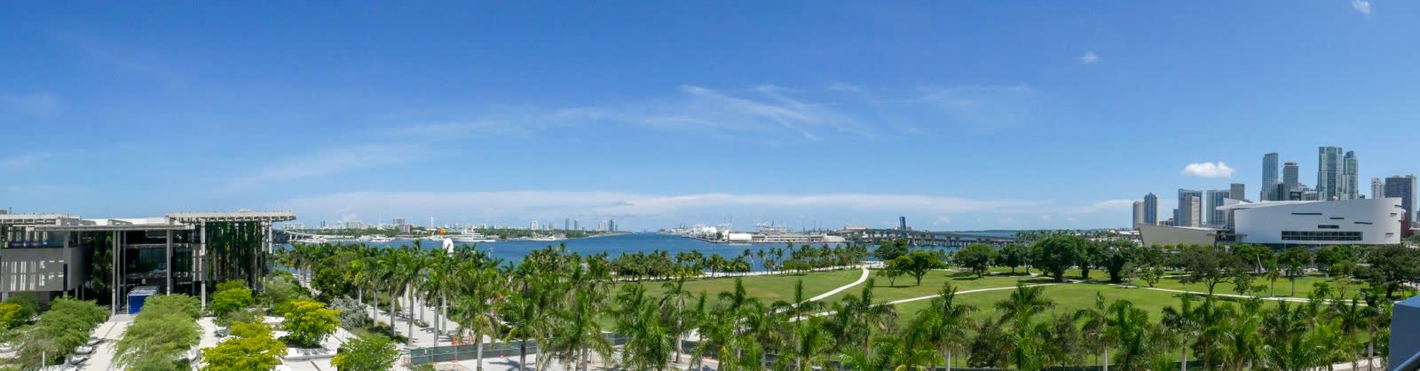 Miami skyline over green parkland on a clear day