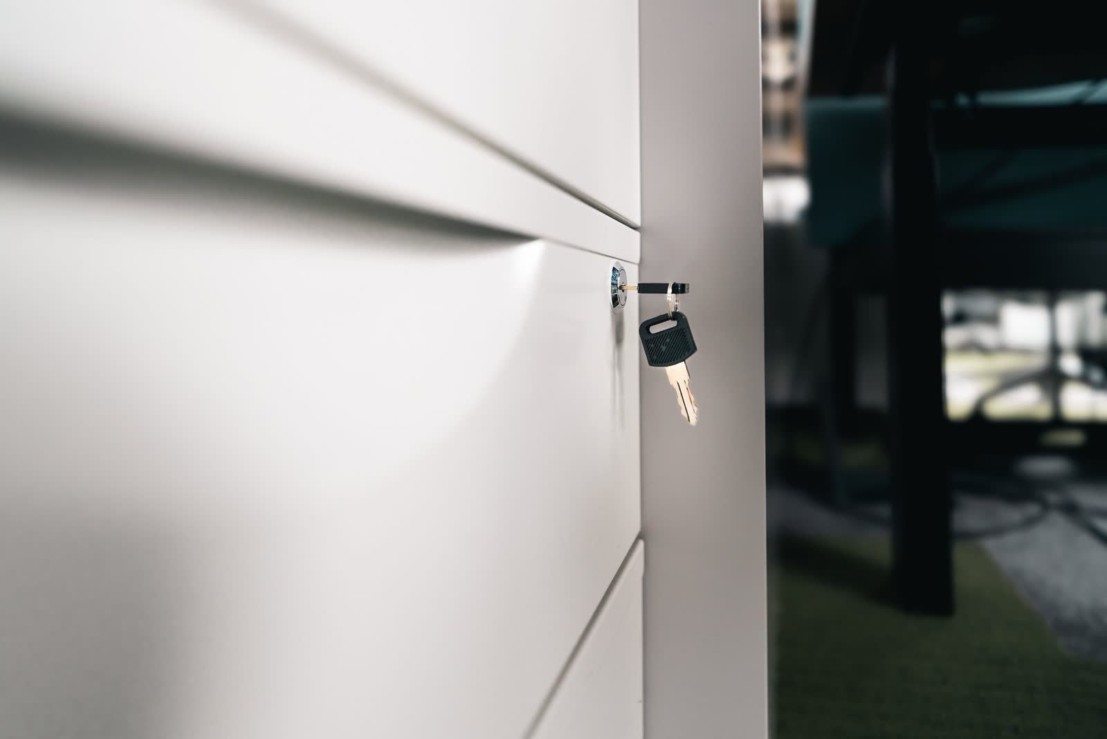 Key left in the lock of a closed office filing drawer
